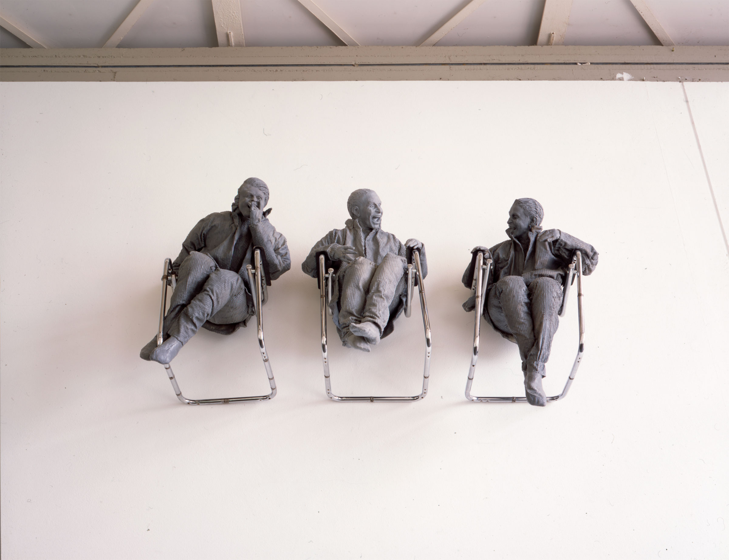 Juan Munoz, Three Seated on the Wall with Big Chair, 2000